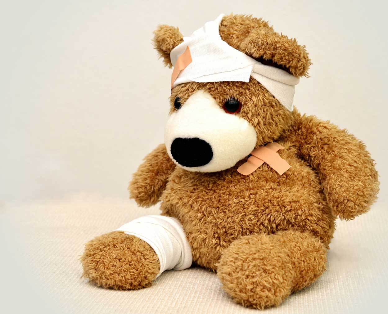 big teddy bear with bandages