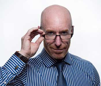 older man holding glasses