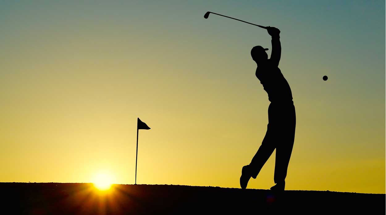 silhouette of golfer