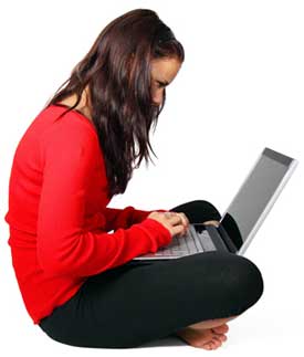 teenager sitting at computer