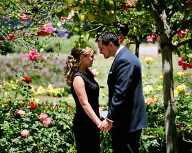 couple holding hands
    in garden