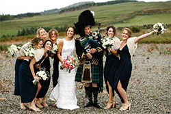 women with Scotish Bagpiper
